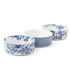 three blue and white bowls sitting next to each other