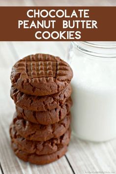 chocolate peanut butter cookies stacked on top of each other next to a glass of milk