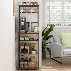 a living room filled with furniture next to a white chair and window covered in blinds