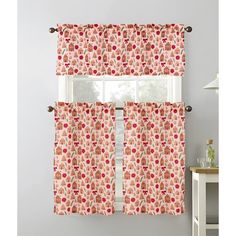 a window curtain with red flowers on it