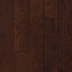 hardwood flooring with dark brown stain and wood grains on the bottom half of it