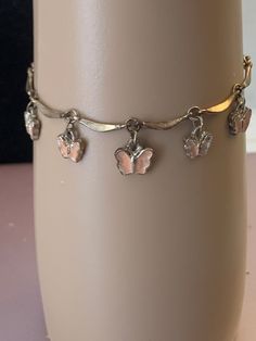 Pink butterflies bracelet Pink Nickel-free Charm Bracelet, Pink Butterfly Charm Bracelet Jewelry, Pink Butterfly Charm Dangle Jewelry, Pink Dangle Jewelry With Butterfly Charm, Adjustable Metal Bracelet With Butterfly Charm, Adjustable Metal Bracelets With Butterfly Charm, Silver Dainty Butterfly Bracelets, Dainty Silver Butterfly Bracelets, Silver Bracelet With Butterfly Clasp