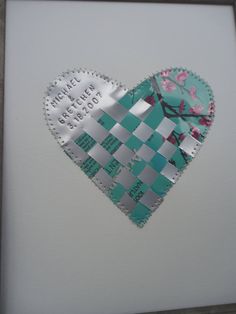 a piece of paper that has been cut into the shape of a checkerboard heart