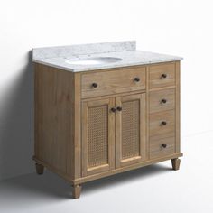 a bathroom vanity with a white marble top