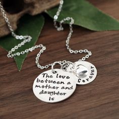 "Check out our Website: ANNIEREH.COM Mother and Daughter is Forever Necklace, Hand Stamped Necklace, Mother's Necklace, Gift for Mom, Mother Daugther Gift, Mommy Jewelry This stamp reads \"The love between a mother and daughter is forever\". Necklace Includes: 1\" sterling silver disc 5/8\" sterling silver disc sterling silver puffed heart silver cable link chain. Custom orders welcome! Please leave detail info in \"message to seller box\" in ETSY! Such as: length of chain and style of chain. Ea Hand Stamped Charm Necklace For Mom, Meaningful Stamped Necklace For Mother's Day, Meaningful Stamped Necklaces For Mother's Day, Inspirational Hand Stamped Necklaces For Mother's Day, Adjustable Hand Stamped Necklace, Stamped Necklaces For Wedding And Mother's Day, Wedding Necklaces For Mother's Day, Wedding Necklace For Mother's Day, Hand Stamped Necklaces For Wedding/mother's Day