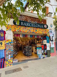 a store front with lots of colorful items on display in the window and outside it