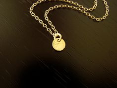 This beautiful 24k vermeil ( gold over sterling silver) disc measures 6x6mm , and floats freely on a gold filled chain, including a spring clasp in gold filled. Your item comes wonderfully boxed and wrapped so you can give it as a gift - or enjoy opening it as a gift yourself! Please note that gold filled jewelry and components have a much higher gold content, and are much more durable and tarnish resistant than gold plated. Gold filled jewelry is also a wonderful and affordable alternative to s Tiny Gold Minimalist Charm Necklaces, Gold Delicate Minimalist Charm Necklaces, Minimalist Handmade Gold Charm Necklace, Gold Charm Necklaces With Round Pendant, Gold Charm Necklace With Round Pendant, Simple Gold Charm Necklace 14k Gold Filled, Dainty Gold Coin Charm Necklace, Simple Gold Charm Necklace In 14k Gold Filled, Simple 14k Gold-filled Charm Necklaces