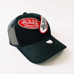 DEADSTOCK VON DUTCH CAP, STILL WITH TAGS AND ORIGINAL PACKAGING 100% AUTHENTIC, BRAND NEW WITH TAGS. Vintage black Von Dutch cap / Von Dutch Cap / Von Dutch trucker cap. White and red classic Von Dutch patches embroidered on front 90s Y2K Cap FULLY TRACKABLE SHIPPING SERVICE. UK AND WORLDWIDE SHIPPING. Black Urban Visor Trucker Hat, Urban Black Trucker Hat With Visor, Black Urban Trucker Hat With Visor, Black Trucker Hat Baseball Cap For Travel, Black Trucker Baseball Cap With Curved Visor, Black Trucker Hat For Travel, Black Hat With Logo Patch And Curved Visor, Black Baseball Cap For Travel, Black Snapback Trucker Hat For Travel