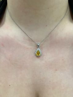 "14k white gold Pear shape/ Tear Drop Yellow Sapphire with Diamond Halo Pendant.  Material: 14k Solid white gold.  Center Stone: Natural Pear Yellow Sapphire.  Yellow Sapphire Weight: 2.06 Carats. Diamonds: 0.83 carats. Diamond Quality: VS2-SI1. Length: Top of the bail to the bottom approximately 1\". Actual Halo Stud is a little over .50 inches. Comes in a nice box.  Chain Included, select 16, 18, or 20\" at check out." Fine Jewelry Platinum Pear-shaped Diamond Necklace, Platinum Necklaces With Diamond Accents, Pear-shaped, Platinum Pear-shaped Diamond Necklace, Yellow Platinum Jewelry With Diamond Accents, Elegant Yellow Platinum Jewelry, Formal Pear-shaped Platinum Jewelry, Elegant Pear-shaped Platinum Jewelry, Elegant Platinum Pear-shaped Jewelry, Yellow Platinum Fine Jewelry