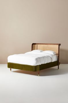 the bed is made up and ready for someone to use it in their home or office