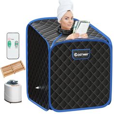 a woman with a towel on her head is sitting in a portable air conditioner