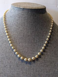 "Signed Faux Champagne 8mm Pearl Choker Necklace Single Strand Sterling Clasp High quality faux champagne pearl necklace with silk cording and hand knotted between pearls. Sterling silver push in clasp. Necklace will arrive gift boxed. * HALLMARKS Clasp is marked Sterling with a makers mark which I couldn't identify. * SIZE/MEASUREMENTS 22\" long with 8mm pearls * CONDITION In very good to excellent condition. Please use all the pictures as part of item's description. * MATERIALS Sterling Silver Adjustable Pearl Chain Necklace For Formal Occasions, Elegant Single Strand Cream Pearl Necklace, Elegant Cream Single Strand Pearl Necklace, Elegant Cream Single Strand Necklace, Adjustable Pearl Charm Necklace For Formal Occasions, Classic Adjustable Pearl Necklace For Formal Occasions, Classic Cream Pearl Necklace With Pearl Charm, Classic Cream Necklace With Pearl Chain, Classic Beaded Pearl Necklace For Evening