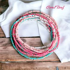 Dive into the enchanting depths of the ocean with our "Coral Reef" seed bead bracelet. inspired by the vibrant hues of a tropical reef, this stunning accessory features a mesmerizing combination of coral, white and teal seas beads woven together to evoke the beauty and diversity of underwater life. This extra-long design allows you to wrap it around your wrist 12 times (on an average 7 inch wrist) for a layered look or even wear it as a necklace or anklet for added flair! 🪸🐠 Dive in and make a Multi-strand Colorful Beads Friendship Bracelets For Beach, Turquoise Faceted Beads Bracelets For Beach, Pink Multi-strand Colorful Beaded Bracelets, Pink Multi-strand Bracelets With Colorful Beads, Pink Multi-strand Colorful Beaded Bracelet, Bohemian Bracelets With Faceted Beads For Beach, Bohemian Faceted Beads Bracelets For Beach, Beach Multi-strand Colorful Beaded Bracelets, Colorful Multi-strand Beaded Bracelets For Beach