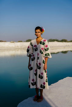 That white dress you need this summer- the JODI version is crafted in handwoven cotton and hand block printed in bold blooms. This fit-and-flare dress has dramatic doubly puffed sleeves and a flattering neckline. A special mention for this handcrafted fabric, it feels lovely on the skin and has a malleable texture. We believe you have a right to know how this product was made. 3.5 metres of handloom fabric sourced from West Bengal has been used for this piece. Hand printed by our artisans in Jaipur, manufactured in our workshop at Pune India. This product is hand-printed in Jaipur, India using traditional techniques. Subtle variations in patterns are natural to this process. We believe this makes each creation unique and charming.If you wish to have the length of the garment altered, pleas Block Print Dress Western, Jaipur Outfits Ideas, Block Print Kurti Designs, Printed Kurti Designs, Mens Outerwear Fashion, Block Print Dress, Handloom Fabric, Printed Kurti, Hand Woven Textiles