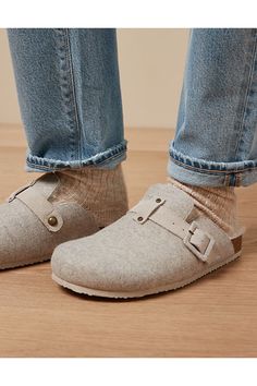 Slip-on silhouette/Felt upper with tonal strap/Faux shearling lining/Round toe Cropped Jeans With Socks, Winter Slip-on Clogs With Buckle Closure, Winter Buckle Closure Slip-on Clogs, Winter Closed Toe Clogs With Textured Footbed, Winter Leather Footbed Slip-on Clogs, Winter Slip-on Clogs With Leather Footbed, Winter Clogs With Buckle Closure And Round Toe, Comfortable Textured Clogs For Fall, Winter Clogs With Textured Footbed And Round Toe