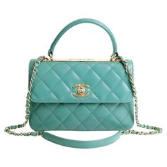 This authentic Chanel Aqua Lambskin Trendy CC Top Handle Bag is in pristine condition. A beautiful classic, the Trendy CC is a ladylike silhouette certain to enhance any collection. Soft aqua green lambskin is quilted in signature Chanel diamond pattern. Gold tone interlocking CC twist lock secures the front flap. Gold metal CHANEL engraved plate beneath the top handle. Interior is conveniently divided into three sections. Carried by the ladylike top handle or the leather and chain entwined shou Chanel Bag Top Handle, Cc Top, Coco Handle, Engraved Plates, Chanel Flap Bag, Bratz Doll, Chanel Bags, Tiffany Blue, Aqua Green