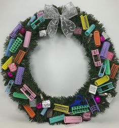 a christmas wreath made out of plastic toys