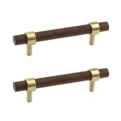 two wooden handles with brass hardware on each end and one has a metal bar in the middle