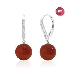 Unleash the fiery allure of our sterling silver carnelian earrings, the perfect 17th Anniversary jewelry gift for women. Featuring AAA quality 10 mm round dark orange gemstone spheres dangling from cubic zirconia accented lever backs. More than just an accessory, these beauties are imbued with the vibrant energy of the carnelian gemstone, known for its association with passion, creativity, and confidence. STYLE TIP: Pair with matching pendant necklace (priced separately) to complete the look PRODUCT INFORMATION -  METAL: Sterling Silver (Plated with rhodium for shine, durability and a tarnish resistant finish) -  LENGTH: 1.1 Inches / 28 mm -  WIDTH - 0.4 Inch / 10 mm -  DROP LENGTH - 1 Inch / 25 mm -  BACKING - Lever Back GEMSTONE -  TYPE: Carnelian -  SHAPE - Round Sphere -  CREATION - Na Classic Carnelian Jewelry For Anniversary, Formal Orange Gemstone Earrings, Elegant Orange Earrings For Formal Occasions, Elegant Red Earrings With Polished Finish, Elegant Orange Gemstone Earrings, Red Polished Earrings For Gift, Modern Carnelian Jewelry For Formal Occasions, Elegant Carnelian Jewelry For Formal Occasions, Modern Orange Sterling Silver Jewelry