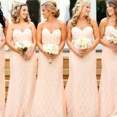 the bridesmaids are all wearing pink dresses and holding bouquets in their hands