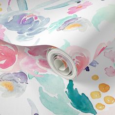 watercolor painted flowers on white background with silver foil roll and rolled up wrapping paper