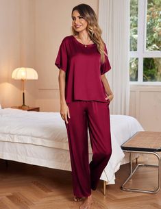 This luxurious pajama set is crafted from Silk Satin fabric for a soft and comfortable feel. Featuring a short sleeve top and long pants with an elastic waist, this set is perfect for lounging around in style. Enjoy the silky smooth fabric that offers breathability and a perfect fit. A lightweight two-piece pajama set featuring a pullover tee top and long pants. Soft satin silky fabric, comfy to wear. Top: Loose fit, satin short sleeve t-shirt. Solid color, crewneck, and a chest pocket casual ni Comfortable Relaxed Fit Short Sleeve Sets, Relaxed Fit Long Pants Sets, Relaxed Fit Solid Color Long Pants Set, Relaxed Fit Short Sleeve Sets, Comfortable Solid Short Sleeve Sets, Comfortable Solid Color Short Sleeve Sets, Solid Color Short Sleeve Sleepwear For Pajama Party, Comfortable Red Sleepwear For Loungewear, Red Relaxed Fit Sleepwear For Loungewear