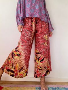 "This may be your new favorite pants , super soft and light trousers Made of bended silk Easy fits with elastic waist Perfect in the city for work or holiday escapades True boho hippie look MEASURE M Waist (stretchy) 30\"-36\" Hips 38\" Leg ( measure from waist ) 38\" MATERIAL  *silk  Thank you for looking" Flowy Viscose Bottoms For Day Out, Fall Wide-leg Viscose Pants, Fall Viscose Wide-leg Pants, Rayon Wide Leg Pants For Summer Day Out, Chic Viscose Pants For Vacation, Ankle-length Wide Leg Pants For Vacation, Wide Leg Rayon Ankle-length Pants For Day Out, Wide Leg Rayon Pants For Day Out, Rayon Wide Leg Ankle-length Pants For Day Out