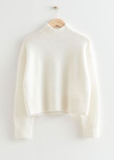 Cropped mock neck knit sweater featuring a cropped, boxy silhouette.– Ribbed collar, cuffs and hemline– Certified according to the Responsible Mohair Standard (CU810300)– Certified according to the Responsible Wool Standard (CU810300)Length of sweater: 51cm / 20.1" (Size S) Camel Winter Coat, Wineries Outfit, Trouser Outfits, Ribbed Turtleneck Sweater, Ribbed Turtleneck, Sweater White, White Sweater, Fashion Story, Cool Sweaters