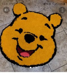 the winnie the pooh rug is on the floor