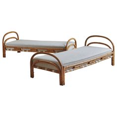 two rattan style daybeds with cushions