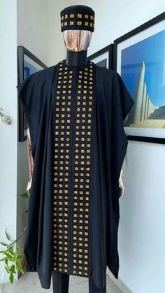 Step into a world of luxury and sophistication with our premium quality 100% cotton Agbada for men. Impeccably designed and tailored, this traditional suit comes in blue-black and gold, adorned with intricate embroidery that showcases the beauty of Yoruba culture. Originating from Nigeria, this garment has become a go-to attire for formal events, such as weddings, engagements, church services, African heritage parties, black history month celebrations, and other special occasions. Latest Agbada Designs, Agbada Styles Men, Agbada Designs For Men, Agbada For Men, Yoruba Culture, Grooms Outfit, Groomsmen Dress, Agbada Design, African Kaftan