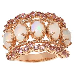 Colleen Lopez Opal and Pink Tourmaline Scalloped Wide Band Ring  This Colleen Lopez ring features stunning opals set on a wide band, plus pretty pink tourmaline stones along the scallop-edged design. Rose gold plating adds a touch of elegance to the already beautiful piece.       Approx. 5/8"L x 1"W x 3/16"H; shank 1/8"W     Stamped .925 sterling silver; rose gold plating   Stone Information       All sizes and weights approximate     White Opal - Oval (7x5mm)     Pink Tourmaline - Round; 1.12ct Pink Opal Rings With Gemstone, Pink Opal Gemstone Rings, Pink Opal Ring Fine Jewelry, Pink Opal Jewelry With Gemstone Detail, Pink Opal Jewelry With Gemstone, Famous Jewelry, Soft Life, Wide Band Ring, Color Bands