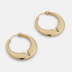 The Lune is a contemporary hoop earring with rounded edges and a deep notch at the center of the design. The domed effect tapers towards the ends, finishing with a minimal pin closure. Materials: Stainless Steel Bracelet Sizes, Earings Piercings, Ring Size, Hoop Earrings, Plating, Stainless Steel, Gold, Design