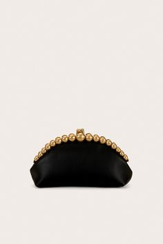 A handheld clutch crafted from leather with circular gold beads and a clasp closure. — Smooth leather — Circular gold bead details — Clasp closure — Handheld design Black And Gold Clutch, Black Clutch Purse, Clutch Purse Black, Gold Clutch, Clutch Black, Sandal Platform, Evening Sandals, Swimming Bag, Fancy Bags