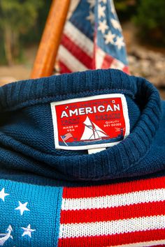 Proudly made in the USA, you can take the helm of your next adventure with the breeze at your back and the salt on your face knowing you’re wearing a little piece of the American Dream. Product Details: Wash Cold, Air Dry Woven Label 100% Cotton Navy Blue background with Flag/Anchor Intarsia design Unisex Tailored Fit--Ladies should size down one size Made in the USA Lobster Sweater, American Sweater, Preppy Men, Ivy Style, The American Dream, New England Style, Navy Blue Background, Woven Labels