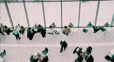 an overhead view of people sitting at tables