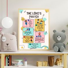 a teddy bear sitting next to a poster with the words the lord's prayer