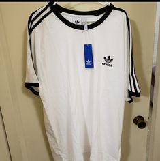 Men's Adidas T-Shirt White Relaxed Fit T-shirt With Three Stripes, Adidas Three Stripes Crew Neck T-shirt, Adidas White Sporty T-shirt, White Adidas Sporty T-shirt, Adidas Three Stripes T-shirt For Streetwear, Adidas White T-shirt For Streetwear, Basic Adidas T-shirt With Three Stripes, Adidas Basic T-shirt With Three Stripes, White Adidas T-shirt For Streetwear