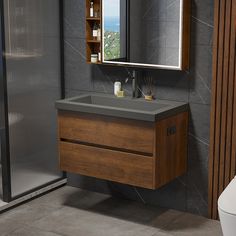 a bathroom with a sink, mirror and shower stall in the corner on the wall