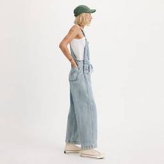 Apron Women's Overalls - Light Wash | Levi's® US Spring Levi's Utility Bottoms, Utility Cotton Overalls For Streetwear, Levi's Casual Denim Jumpsuit For Spring, Levi's Spring Utility Bottoms, Levi's Casual Overalls With Pockets, Levi's Spring Casual Denim Jumpsuit, Casual Levi's Overalls With Pockets, Spring Levi's Cotton Denim Jumpsuit, Spring Utility Cotton Overalls