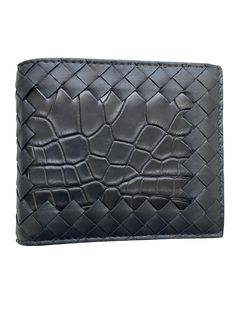 The Bottega Veneta Intrecciato Nappa/Croc Leather Bifold Wallet features 8 interior card slots, two bill compartments, and two additional pockets. Crafted with Nappa Leather and Croc Leather with Calfskin lining, this Italian-made accessory is a wonderful addition to your luxury small leather items collection. Intrecciato leather wallet with croc leather section on the front Eight interior card slots, two bill compartments, two additional pockets Material:100% Calfskin with a frontal croc leathe Luxury Crocodile Pattern Wallets For Business, Luxury Crocodile Pattern Wallet For Business, Luxury Wallets With Crocodile Pattern For Business, Luxury Business Wallets With Crocodile Pattern, Luxury Crocodile Pattern Business Wallets, Leather Bifold Wallet With Crocodile Pattern, Business Bifold Wallets With Crocodile Pattern, Classic Leather Wallet With Crocodile Pattern, Black Leather Wallet With Crocodile Pattern