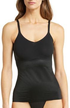 Create a smooth look under everyday outfits with this lightweight, breathable shaping cami that wraps around your body and targets your tummy and sides. The stretchy, single-layer fabric smoothes out any lumps or bumps, and the noncompression bust offers a squish-free fit. 15 1/2" center front length (size Medium) Scoop neck Adjustable straps 77% nylon, 23% elastane body; 55% nylon, 45% Lycra® elastane bust Machine wash, tumble dry Imported Workout Top With Built-in Bra And Second-skin Fit, Workout Shapewear With Built-in Bra, Workout Shapewear With Built-in Bra In Nylon, Supportive Shapewear Tank Top With Built-in Bra, Nylon Shapewear With Built-in Bra For Workout, Seamless Fitted Activewear For Layering, Fitted Seamless Shapewear For Gym, Seamless Compression Sleeveless Shapewear, Black Full Coverage Shapewear Top