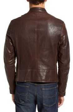 Italian vegetable-tanned lambskin leather elevates an American-made café racer jacket with indelible appeal. 24" length Front zip closure Band collar Side zip pockets Lined Leather Professional leather clean Made in the USA of imported material Men's Clothing Cafe Racer Leather Jacket For Fall, Fitted Leather Cafe Racer Jacket, Leather Biker Jacket For Motorcycling, Leather Cafe Racer Outerwear For Fall, Classic Leather Motorcycle Jacket, Rugged Fitted Leather Jacket For Biker Events, Brown Fitted Leather Jacket For Motorcycling, Classic Leather Jacket For Motorcycling, Leather Jacket With Zipper Closure For Motorcycling