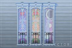 three stained glass windows on the side of a building