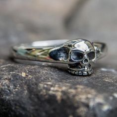 *  Simple yet effective skull ring*  Hand made in our workshops in Devon*  .925 fully hall marked sterling silver ring*  Available in J - X*  Special Sizes are available on request Skull Shaped Sterling Silver Ring In White Gold, Classic White Gold Skull Ring In Sterling Silver, Classic White Gold Sterling Silver Skull Ring, Gothic Skull Ring With Polished Finish Gift, Gothic Skull Ring With Polished Finish, Collectible Sterling Silver Skull Ring With Polished Finish, Classic Sterling Silver Skull Ring With Polished Finish, Classic Engraved Sterling Silver Skull Ring, Gothic Sterling Silver Rings With Skull Print