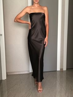 Strapless silk satin slip dress. Can be worn as a bridesmaid dress, party and date dress and for many other occasions. Made of satin silk. DESCRİPTİON:   -Strapless.  -Elastic band on the bust part.  -Adjustable bust.  -Designed for a slim but relaxed fit.  -Unlined.  -Bias cut. İt is a custom made dress, tailored according to your preferences, you can choose the length of the dress and order it without cut on the front.  While ordering write your bust and waist measure, so the dress will be made to your size. Please enquire if you're interested in different color. SIZING INFO: XS/34/US4: bust: 82-86cm (32-33 inch) waist 64-66 cm (24-25 inch)  S/36/ US6: bust: 86-88cm (33-34 inch) waist: 66-68 cm (25-26 inch) M/38/ US8: bust: 88-92 cm (34-36 inch) waist: 68-72 cm (26-28 inch) L/40/ US10: Long Tube Top Dress, Satin Maxi Slip Dress For Party, Wedding Satin Dress With Straight Neckline, Elegant Strapless Dress With Satin Finish, Elegant Strapless Dress With Satin Finish For Formal Occasions, Elegant Silk Strapless Dress For Prom, Elegant Formal Strapless Dress With Satin Finish, Elegant Silk Strapless Dress For Prom Season, Elegant Strapless Satin Dress For Prom