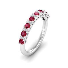 This exquisite diamond and ruby ring is a stunning piece of jewelry that exudes elegance and sophistication. The brilliant diamonds are carefully set alongside vibrant rubies, creating a striking contrast that is sure to catch the eye of anyone who sees it. Metal: 14K Gold Setting Type: Prong Rhodium Finish: Yes, on White Gold Gemstone Details: Gemstone: Ruby Shape: Round Average Dimensions: 2.50 MM Quantity: 08 Average Cut: Very Good Average Color: Medium to Dark Red Average Clarity: Eye Clean Luxury Red Diamond Ring With Single Cut Diamonds, Red Ruby Ring With Diamond And Pave Setting, Red Diamond Ring With Pave Setting, Fine Jewelry Red Diamond Ring With Pave Setting, Anniversary Ruby Ring With Pave Setting, Red Pave Setting Fine Jewelry Rings, Fine Jewelry Ruby Ring With Pave Setting For Anniversary, Red Diamond Rings With Pave Setting, Red Rings With Pave Setting In Fine Jewelry