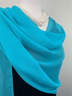 Elevate your style with our exquisite collection of chiffon shawls. Our chiffon shawls are the epitome of elegance and versatility, designed to effortlessly enhance your wardrobe and leave a lasting impression. Made from the fine poly chiffon fabric, these shawls offer a delicate and airy drape that adds a touch of grace to any outfit. Whether you're attending a special occasion, a casual gathering, or simply want to elevate your everyday look, our chiffon shawls are the perfect accessory. Choos Elegant Blue Shawl Scarves, Elegant Blue Scarves For Party, Elegant Green Scarves For Party, Elegant Blue Silk Shawl Scarf, Elegant Blue Silk Scarf For Formal Occasions, Elegant Green Silk Scarf, Elegant Blue Silk Shawl, Elegant Blue Silk Scarf For Evening, Elegant Blue Silk Scarf For Wedding