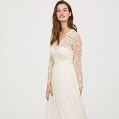 Dress Features A Beautiful V-Shaped Neckline, A Lace Bodice, Delicate Lace Sleeves, And A Flared Skirt. New With Tags, Never Been Worn. No Stains, Tears Or Imperfections. Color Is Ivory, Not Pure White. Original Price $299 Sheer Bodice V-neck Wedding Dress, Elegant V-neck Bridal Dress, White V-neck Wedding Dress With Lace Bodice, V-neck Maxi Dress With Sheer Bodice For Wedding, White Dresses With Sheer Sleeves And Fitted Bodice, Long Sleeve Delicate Lace Dress For Formal Occasions, Long Sleeve Lace Dress With Illusion Neckline, Long Sleeve Lace Dress With Fitted Bodice For Wedding, Lace Dress With Illusion Neckline And Long Sleeves