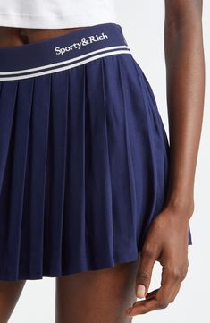 Sporty stripes and a logo embroidery highlight the waist of this preppy skirt boasting crisp allover pleats. Elastic waist 100% viscose Dry clean or machine wash, line dry Imported Asian & Pacific Islander Owned/Founded Relaxed Tennis Skirt With Accordion Pleats, Relaxed Pleated Waist Tennis Skirt, Classic Spring Tennis Skirt With Pleated Waist, Navy Pleated Skort, Classic Spring Pleated Tennis Skirt, Preppy Pleated Flared Tennis Skirt, Preppy Pleated Flared Mini Skirt, Classic Summer Tennis Skirt With Pleated Hem, Preppy Pleated Flared Skirt With Lining